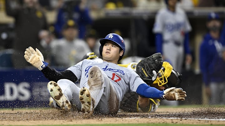 Oct 9, 2024; San Diego, California, USA; San Diego Padres catcher Kyle Higashioka (20) tags out Los Angeles Dodgers designated hitter Shohei Ohtani (17) at home in the fourth inning during game four of the NLDS for the 2024 MLB Playoffs at Petco Park. 