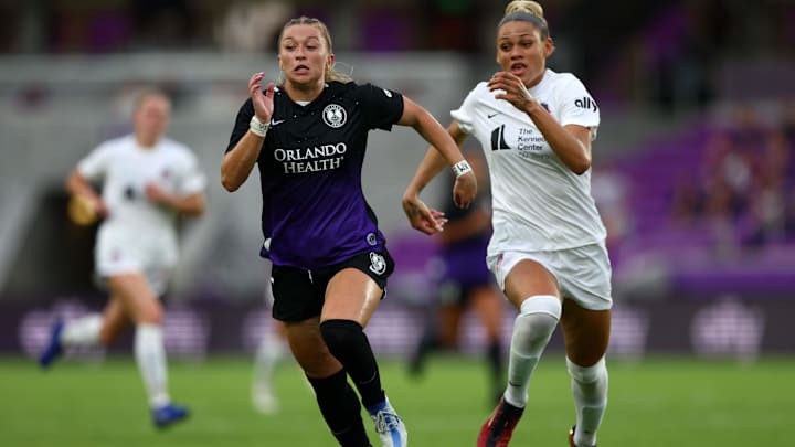 May 27, 2022; Orlando, Florida, USA;  Orlando Pride defender Courtney Petersen (17) and Washington
