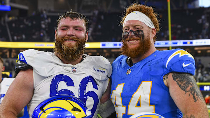 Aug 16, 2025; Inglewood, California, USA; Los Angeles Rams offensive tackle Ben Dooley (66) and Los Angeles Chargers fullback Scott Matlock (44) after the game at SoFi Stadium. Mandatory Credit: Jonathan Hui-Imagn Images