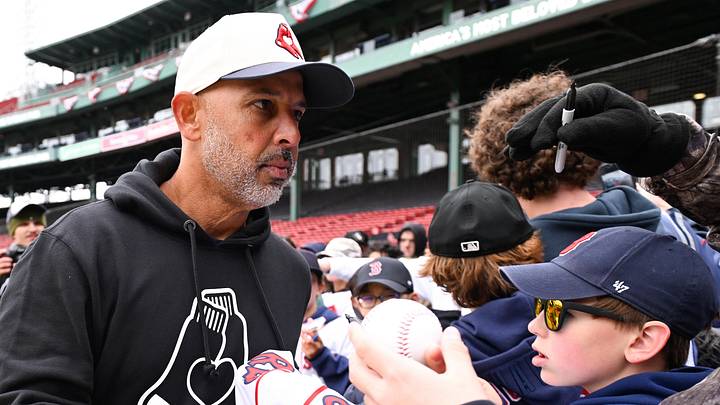 Apr 4, 2026; Foxborough, Massachusetts, USA; Boston Red Sox manager Alex Cora (13) signs autographs for fans before a game against the San Diego Padres at Fenway Park. Mandatory Credit: Eric Canha-Imagn Images