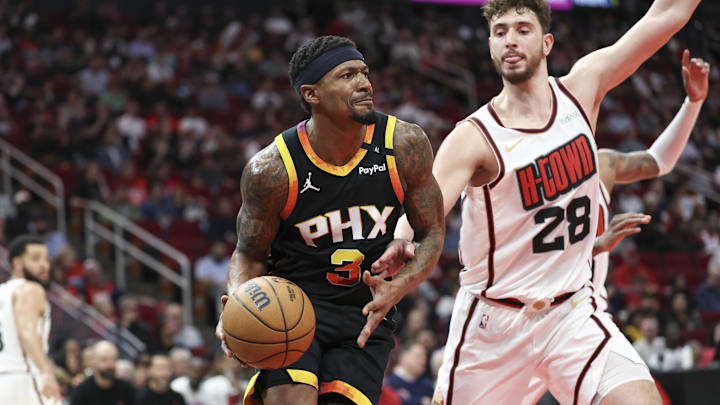 Mar 12, 2025; Houston, Texas, USA; Phoenix Suns guard Bradley Beal (3) controls the ball as Houston Rockets center Alperen Sengun (28) defends during the second quarter at Toyota Center. Mandatory Credit: Troy Taormina-Imagn Images