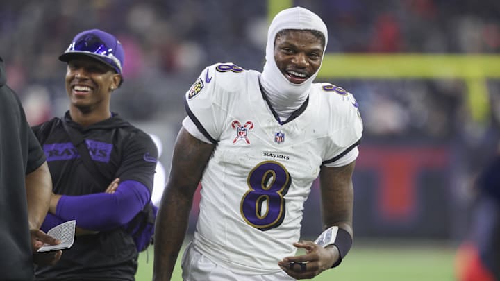 Baltimore Ravens quarterback Lamar Jackson  smiles during the fourth quarter against the Houston Texans at NRG Stadium.
