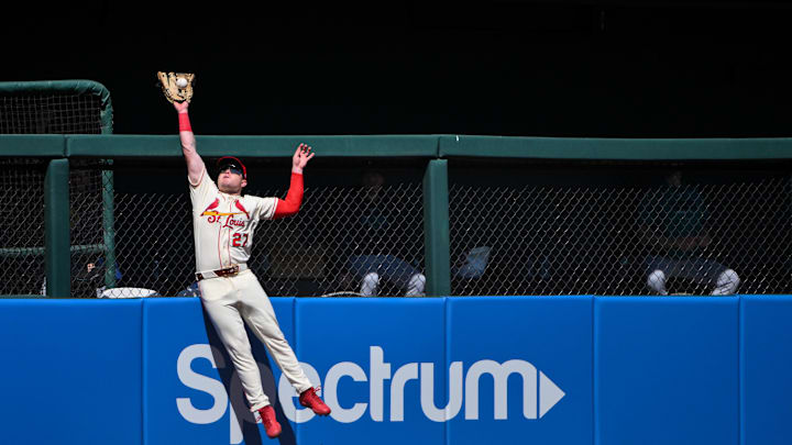 Apr 25, 2026; St. Louis, Missouri, USA; St. Louis Cardinals left fielder Nathan Church (27) leaps at the wall and robs a home run from Seattle Mariners catcher Mitch Garver (not pictured) during the sixth inning at Busch Stadium. Mandatory Credit: Jeff Curry-Imagn Images