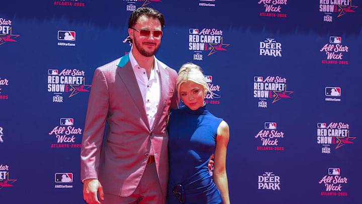 Jul 15, 2025; Atlanta, GA, USA; National League pitcher Paul Skenes (30) of the Pittsburgh Pirates and social media influencer Livvy Dunne pose for a photo on the red carpet before the 2025 MLB All Star Game at Truist Park. Mandatory Credit: Brett Davis-Imagn Images