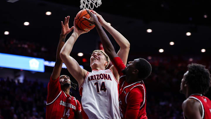 Dec 7, 2024; Tucson, Arizona, USA; Southern Utah Thunderbirds forward Jamari Sibley (14) and center Malik Lamin (32) battle for the rebound with Arizona Wildcats center Motiejus Krivas (14) during the second half at McKale Center. Mandatory Credit: Aryanna Frank-Imagn Images