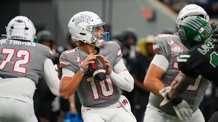 Dec 23, 2025; Frisco, TX, USA;  UNLV Rebels quarterback Anthony Colandrea (10) looks downfield against the Ohio Bobcats during the first half at the Ford Center at The Star. Mandatory Credit: Raymond Carlin III-Imagn Images