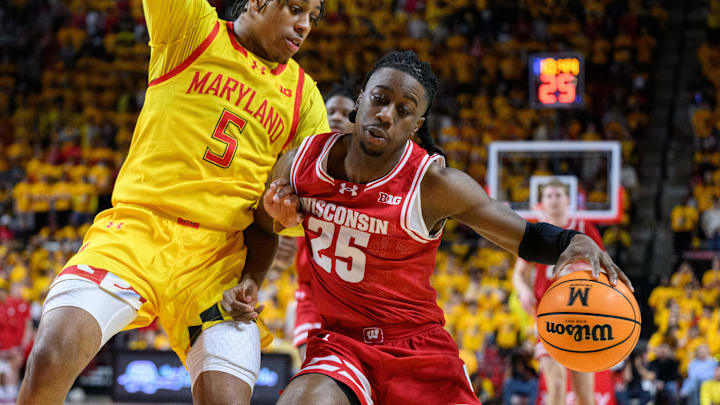 Jan 29, 2025; College Park, Maryland, USA; Wisconsin Badgers guard John Blackwell (25) handles the ball against Maryland Terrapins guard DeShawn Harris-Smith (5) during the first half at Xfinity Center. Jan 29, 2025; College Park, Maryland, USA; Wisconsin Badgers guard John Blackwell (25) handles the ball against Maryland Terrapins guard DeShawn Harris-Smith (5) during the first half at Xfinity Center.