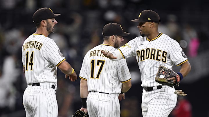 Sep 5, 2023; San Diego, California, USA; San Diego Padres shortstop Xander Bogaerts (right) celebrates with first baseman Matt Carpenter (14) and second baseman Matthew Batten (17) after defeating the Philadelphia Phillies at Petco Park. Sep 5, 2023; San Diego, California, USA; San Diego Padres shortstop Xander Bogaerts (right) celebrates with first baseman Matt Carpenter (14) and second baseman Matthew Batten (17) after defeating the Philadelphia Phillies at Petco Park.