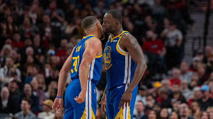 Oct 23, 2024; Portland, Oregon, USA;  Golden State Warriors point guard Stephen Curry (30) and power forward Draymond Green (23) celebrate during the second half against the Portland Trailblazers at Moda Center. Mandatory Credit: Stephen Brashear-Imagn Images