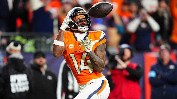 Dec 15, 2024; Denver, Colorado, USA; Denver Broncos wide receiver Courtland Sutton (14) prepares to pull in a touchdown reception in the fourth quarter against the Indianapolis Colts at Empower Field at Mile High. 