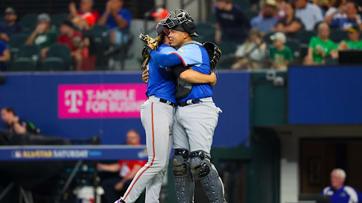 Jul 13, 2024; Arlington, TX, USA; National League Future  pitcher Bubba Chandler (l) hugs National League Future catcher Thayron Liranzo (r) after the game against the American League Future team during the Major league All-Star Futures game at Globe Life Field.  