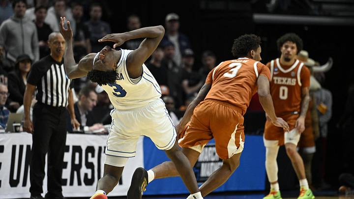 Mar 19, 2026; Portland, OR, USA; BYU Cougars forward AJ Dybantsa (3) reacts after being hit by Texas Longhorns forward Dailyn Swain (3) in the second half during a first round game of the men's 2026 NCAA Tournament at Moda Center. Mandatory Credit: Troy Wayrynen-Imagn Images