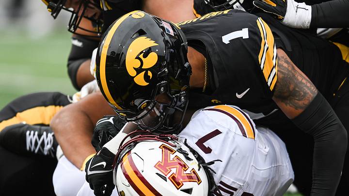 Oct 25, 2025; Iowa City, Iowa, USA; Iowa Hawkeyes defensive back Xavier Nwankpa (1) tackles Minnesota Golden Gophers running back Fame Ijeboi (7) during the first quarter at Kinnick Stadium. Mandatory Credit: Jeffrey Becker-Imagn Images Oct 25, 2025; Iowa City, Iowa, USA; Iowa Hawkeyes defensive back Xavier Nwankpa (1) tackles Minnesota Golden Gophers running back Fame Ijeboi (7) during the first quarter at Kinnick Stadium. Mandatory Credit: Jeffrey Becker-Imagn Images