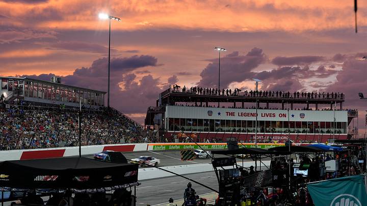 Jul 19, 2026; North Wilkesboro, North Carolina, USA; Sun sets in turn four during the Window World 400 at North Wilkesboro Speedway. Jul 19, 2026; North Wilkesboro, North Carolina, USA; Sun sets in turn four during the Window World 400 at North Wilkesboro Speedway.