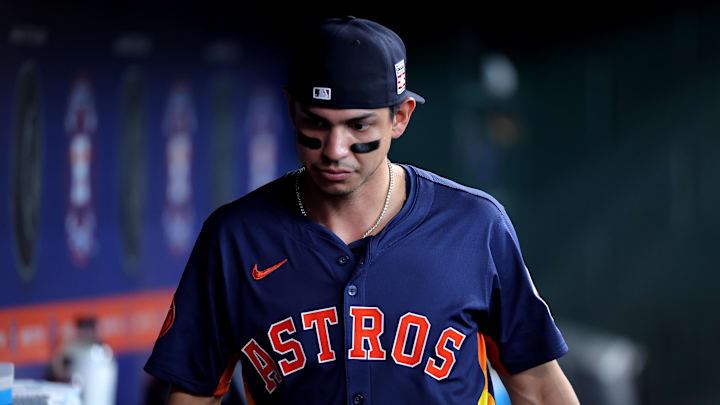 Jul 27, 2025; Houston, Texas, USA; Houston Astros third baseman Mauricio Dubon (14) in the dugout prior to a game against the Athletics at Daikin Park.