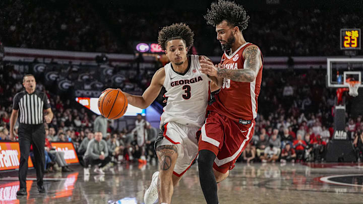 Mar 3, 2026; Athens, Georgia, USA; Georgia Bulldogs guard Jordan Ross (3) dribbles against Alabama Crimson Tide guard Houston Mallette (95) at Stegeman Coliseum. Mandatory Credit: Dale Zanine-Imagn Images