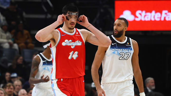 Jan 20, 2025; Memphis, Tennessee, USA; Memphis Grizzlies center Zach Edey (14) adjust his face mask during the second quarter against the Minnesota Timberwolves at FedExForum. Mandatory Credit: Petre Thomas-Imagn Images