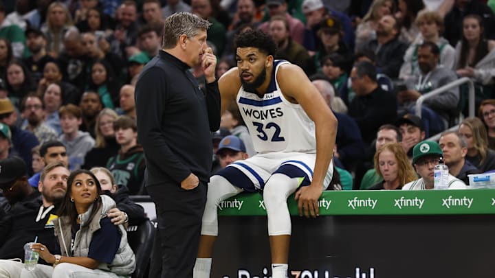 Mar 27, 2022; Boston, Massachusetts, USA; Minnesota Timberwolves head coach Chris Finch talks with center Karl-Anthony Towns (32) during the second half against the Boston Celtics at TD Garden. Mandatory Credit: Winslow Townson-Imagn Images