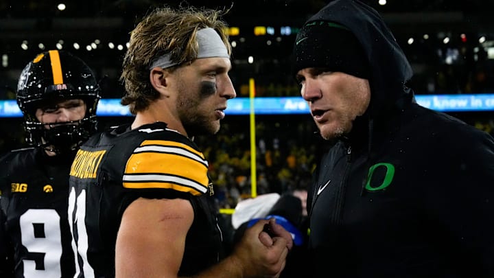 Iowa Hawkeyes quarterback Mark Gronowski (11) shakes hands Nov. 8, 2025 after a Big Ten Football game against the Oregon Ducks at Kinnick Stadium in Iowa City, Iowa.