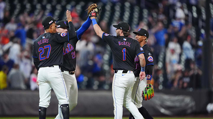 Jun 14, 2024; New York City, New York, USA; New York Mets third baseman Mark Vientos (27) and second baseman Jeff McNeil (1) and shortstop Francisco Lindor (12) and first baseman Pete Alonso (20) celebrate the victory together after the ninth inning against the San Diego Padres at Citi Field. Mandatory Credit: Gregory Fisher-USA TODAY Sports