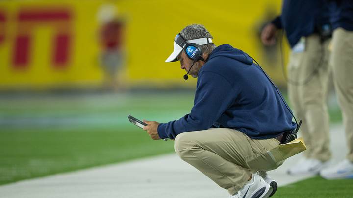 Sep 6, 2026; Nashville, Tennessee, USA; Ole Miss Rebels head coach Pete Golding looks over his play sheet against the Louisville Cardinals during the second half at Nissan Stadium. Mandatory Credit: Steve Roberts-Imagn Images Sep 6, 2026; Nashville, Tennessee, USA; Ole Miss Rebels head coach Pete Golding looks over his play sheet against the Louisville Cardinals during the second half at Nissan Stadium. Mandatory Credit: Steve Roberts-Imagn Images
