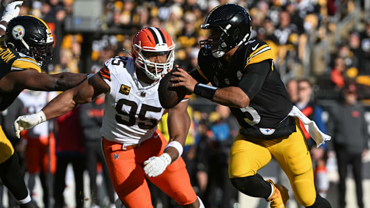 Dec 8, 2024; Pittsburgh, Pennsylvania, USA; Pittsburgh Steelers quarterback Russell Wilson (3) is chased by Cleveland Browns defensive end Myles Garrett (95) during the first quarter at Acrisure Stadium. Mandatory Credit: Barry Reeger-Imagn Images