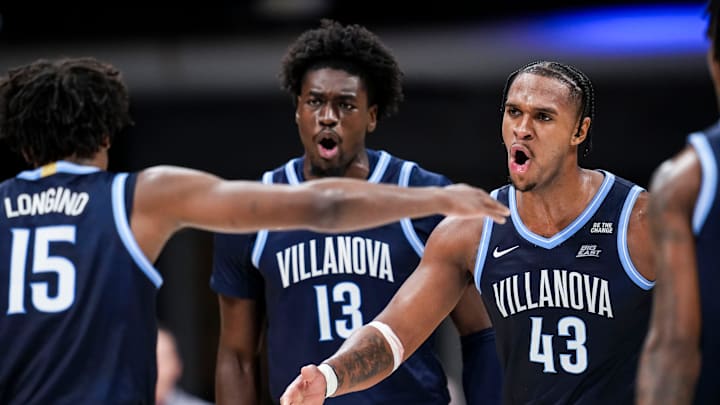 Villanova Wildcats guard Jordan Longino (15), Villanova Wildcats forward Enoch Boakye (13) and Villanova Wildcats forward Eric Dixon (43) celebrate Wednesday, Jan. 1, 2025, during an NCAA men’s basketball game between the Butler Bulldogs and the Villanova Wildcats at Hinkle Fieldhouse in Indianapolis.