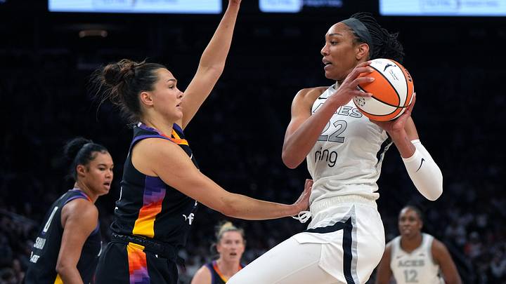 Jun 29, 2025; Phoenix, Arizona, USA; Las Vegas Aces center A'ja Wilson (22) looks to shoot over Phoenix Mercury forward Kathryn Westbeld (24)  in the first half at Footprint Center. Mandatory Credit: Rick Scuteri-Imagn Images