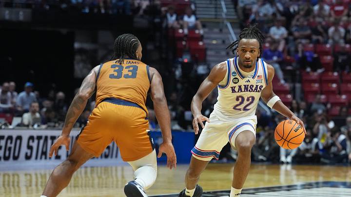 Mar 20, 2026; San Diego, CA, USA; Kansas Jayhawks guard Darryn Peterson (22) controls the ball against California Baptist Lancers guard Martel Williams (33) in the first half during a first round game of the men's 2026 NCAA Tournament at Viejas Arena. Mandatory Credit: Kirby Lee-Imagn Images Mar 20, 2026; San Diego, CA, USA; Kansas Jayhawks guard Darryn Peterson (22) controls the ball against California Baptist Lancers guard Martel Williams (33) in the first half during a first round game of the men's 2026 NCAA Tournament at Viejas Arena. Mandatory Credit: Kirby Lee-Imagn Images