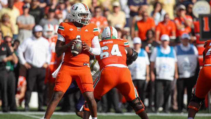 Nov 9, 2024; Atlanta, Georgia, USA; Miami Hurricanes quarterback Cam Ward (1) drops back to pass against the Georgia Tech Yellow Jackets in the fourth quarter at Bobby Dodd Stadium at Hyundai Field. Mandatory Credit: Brett Davis-Imagn Images