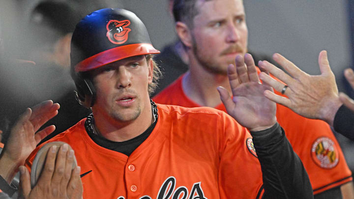 Mar 29, 2025; Toronto, Ontario, CAN; Baltimore Orioles designated hitter Adley Rutschmann (35) celebrates with team mates in the dugout after scoring a run against the Toronto Blue Jays in the fifth inning at Rogers Centre. / Dan Hamilton-Imagn Images Mar 29, 2025; Toronto, Ontario, CAN; Baltimore Orioles designated hitter Adley Rutschmann (35) celebrates with team mates in the dugout after scoring a run against the Toronto Blue Jays in the fifth inning at Rogers Centre. / Dan Hamilton-Imagn Images