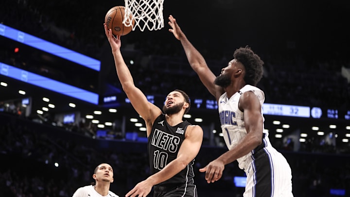 Nov 29, 2024; Brooklyn, New York, USA; Brooklyn Nets guard Ben Simmons (10) drives past Orlando Magic forward Jonathan Isaac (1) for a layup in the second quarter at Barclays Center. Mandatory Credit: Wendell Cruz-Imagn Images Nov 29, 2024; Brooklyn, New York, USA; Brooklyn Nets guard Ben Simmons (10) drives past Orlando Magic forward Jonathan Isaac (1) for a layup in the second quarter at Barclays Center. Mandatory Credit: Wendell Cruz-Imagn Images