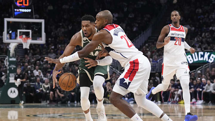 Oct 22, 2025; Milwaukee, Wisconsin, USA; Milwaukee Bucks forward Giannis Antetokounmpo (34) collides with Washington Wizards forward Khris Middleton (22) in the first half while driving to the basket in the first half at Fiserv Forum. Mandatory Credit: Michael McLoone-Imagn Images Oct 22, 2025; Milwaukee, Wisconsin, USA; Milwaukee Bucks forward Giannis Antetokounmpo (34) collides with Washington Wizards forward Khris Middleton (22) in the first half while driving to the basket in the first half at Fiserv Forum. Mandatory Credit: Michael McLoone-Imagn Images