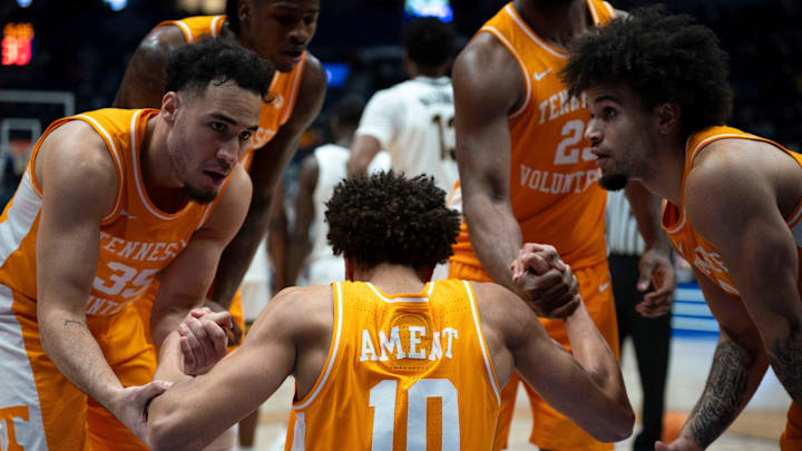 Tennessee forward Nate Ament (10) is helped up after a hard foul from a Vanderbilt player during their quarterfinal game of the 2026 SEC Men’s Basketball Tournament at Bridgestone Arena in Nashville, Tenn., Friday, March 13, 2026.