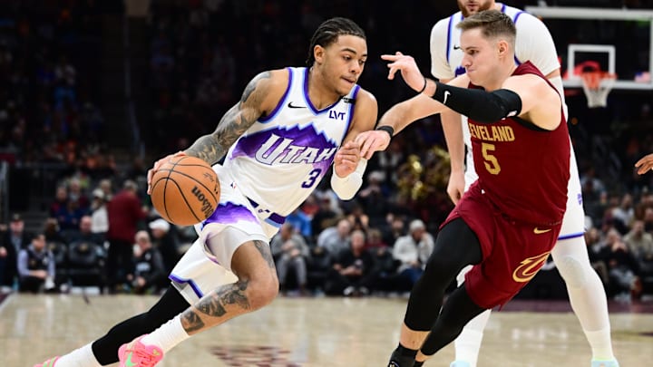 Jan 12, 2026; Cleveland, Ohio, USA; Utah Jazz guard Keyonte George (3) drives to the basket against Cleveland Cavaliers guard Sam Merrill (5) during the second half at Rocket Arena. Mandatory Credit: Ken Blaze-Imagn Images