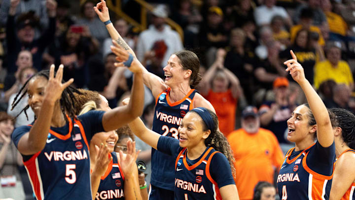 The Virginia Cavaliers celebrate after upsetting the Georgia Bulldogs March 21, 2026 during a First Round NCAA March Madness game at Carver-Hawkeye Arena in Iowa City, Iowa. The Virginia Cavaliers celebrate after upsetting the Georgia Bulldogs March 21, 2026 during a First Round NCAA March Madness game at Carver-Hawkeye Arena in Iowa City, Iowa.
