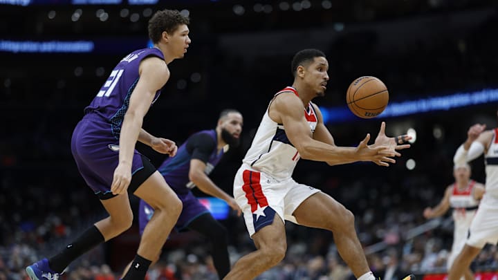 Dec 19, 2024; Washington, District of Columbia, USA; Washington Wizards guard Malcolm Brogdon (15) loses the erball as Charlotte Hornets forward Tidjane Salaun (31) defends in the third quarter at Capital One Arena. Mandatory Credit: Geoff Burke-Imagn Images