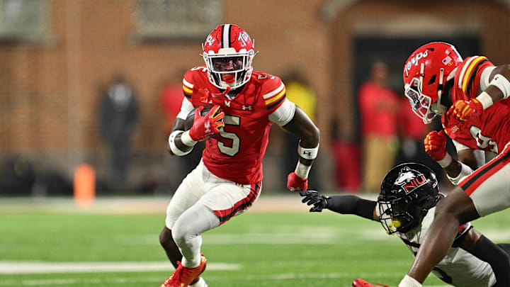 Sep 5, 2025; College Park, Maryland, USA;  Maryland Terrapins wide receiver Octavian Smith Jr. (5) carries the ball against the Northern Illinois Huskies at SECU Stadium. Mandatory Credit: Jamie Sabau-Imagn Images
