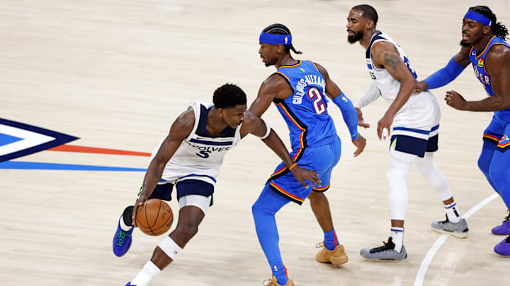 May 28, 2025; Oklahoma City, Oklahoma, USA; Minnesota Timberwolves guard Anthony Edwards (5) drives to the basket against Oklahoma City Thunder guard Shai Gilgeous-Alexander (2) during the third quarter in game five of the western conference finals for the 2025 NBA Playoffs at Paycom Center. Mandatory Credit: Alonzo Adams-Imagn Images