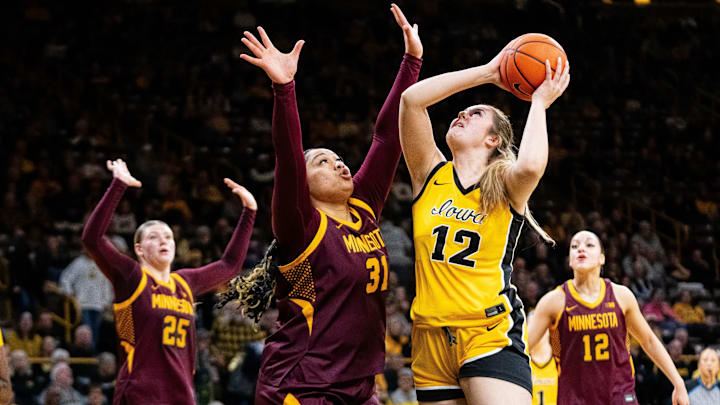 Iowa center Layla Hays (12) shoots the ball against Minnesota forward Finau Tonga (31) on Feb. 5, 2026, at Carver-Hawkeye Arena.