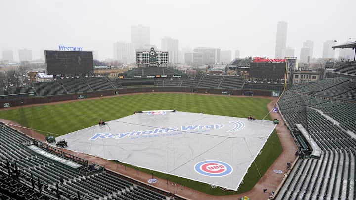A tarp covers the Wrigley Field infield A tarp covers the Wrigley Field infield