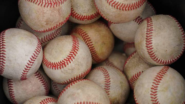 Baseballs sit in a bucket during the KSHSAA Class 4A semifinal game at Tointon Family Stadium in Manhattan on May 28, 2026.