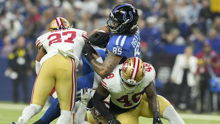 Dec 22, 2025; Indianapolis, Indiana, USA; Indianapolis Colts tight end Andrew Ogletree (85) is brought down by San Francisco 49ers safety Ji'Ayir Brown (27), San Francisco 49ers linebacker Dee Winters (53) and San Francisco 49ers linebacker Tatum Bethune (48) during the second quarter at Lucas Oil Stadium. Mandatory Credit: Christine Tannous-USA TODAY Network via Imagn Images Dec 22, 2025; Indianapolis, Indiana, USA; Indianapolis Colts tight end Andrew Ogletree (85) is brought down by San Francisco 49ers safety Ji'Ayir Brown (27), San Francisco 49ers linebacker Dee Winters (53) and San Francisco 49ers linebacker Tatum Bethune (48) during the second quarter at Lucas Oil Stadium. Mandatory Credit: Christine Tannous-USA TODAY Network via Imagn Images