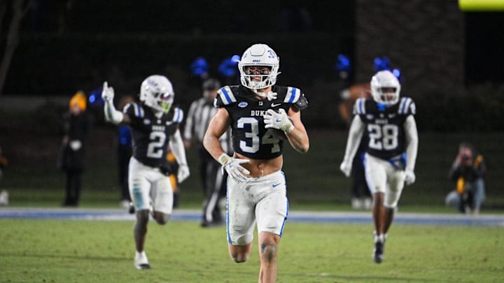 Nov 29, 2025; Durham, North Carolina, USA;  Duke Blue Devils linebacker Luke Mergott (34) reacts after recovering a fumble against the Wake Forest Demon Deacons during the fourth quarter at Wallace Wade Stadium. Mandatory Credit: Zachary Taft-Imagn Images
