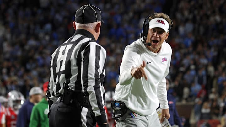 Nov 1, 2025; Oxford, Mississippi, USA; Mississippi Rebels head coach Lane Kiffin reacts toward an official during the first quarter against the South Carolina Gamecocks at Vaught-Hemingway Stadium. Mandatory Credit: Petre Thomas-Imagn Images Nov 1, 2025; Oxford, Mississippi, USA; Mississippi Rebels head coach Lane Kiffin reacts toward an official during the first quarter against the South Carolina Gamecocks at Vaught-Hemingway Stadium. Mandatory Credit: Petre Thomas-Imagn Images
