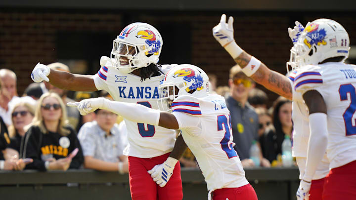 Sep 6, 2025; Columbia, Missouri, USA; Kansas Jayhawks defensive back Austin Alexander (0) celebrates with teammates after recovering a fumble for a touchdown during the first half against the Missouri Tigers at Faurot Field at Memorial Stadium. Mandatory Credit: Jay Biggerstaff-Imagn Images