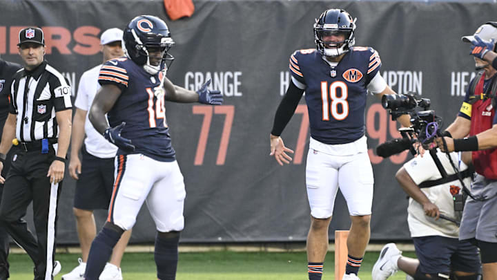 Aug 17, 2025; Chicago, Illinois, USA;  Chicago Bears wide receiver Olamide Zaccheaus (14) celebrates with Chicago Bears quarterback Caleb Williams (18) after scoring a touchdown against the Buffalo Bills during the first half at Soldier Field. Mandatory Credit: Matt Marton-Imagn Images