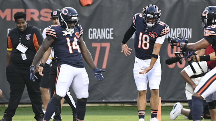 Bears receiver Olamide Zaccheaus (14) celebrates with quarterback Caleb Williams (18) in the preseason.