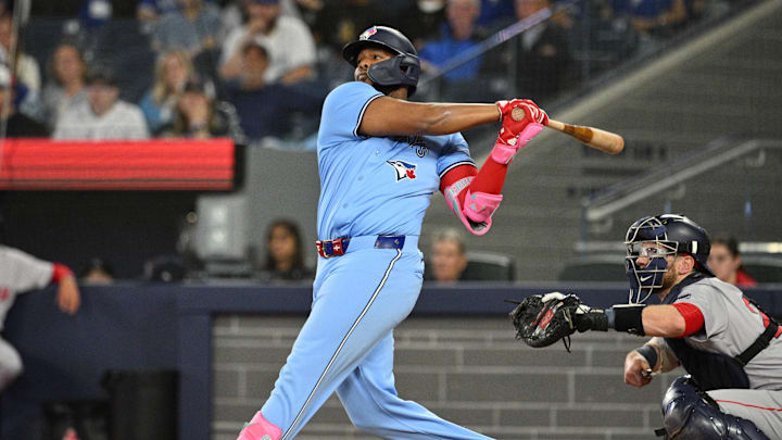 Toronto Blue Jays designated hitter Vladimir Guerrero Jr. (27) hits a two run RBI double against the Boston Red Sox in the third inning at Rogers Centre in 2024. Toronto Blue Jays designated hitter Vladimir Guerrero Jr. (27) hits a two run RBI double against the Boston Red Sox in the third inning at Rogers Centre in 2024.