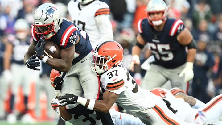 Oct 26, 2025; Foxborough, Massachusetts, USA; New England Patriots running back Terrell Jennings (26) is tackled by Clevelan